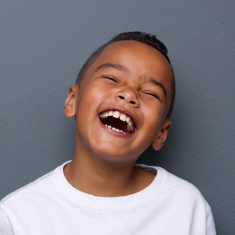 young boy with a big smile
